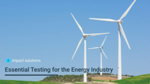 Three wind turbines stand against a blue sky backdrop